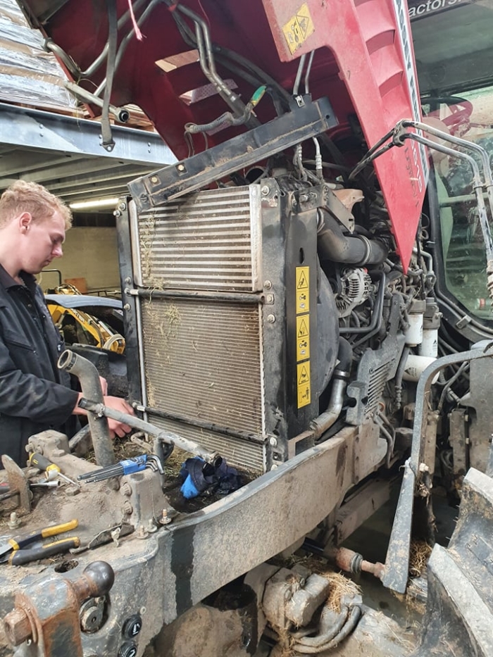 Working on a Massey Freguson in the workshop